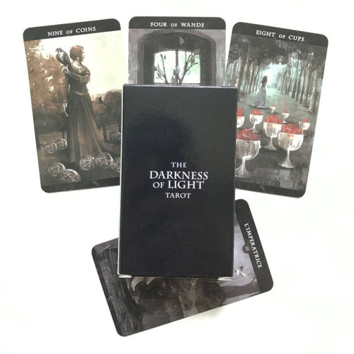 The Darkness Of Light Tarot Cards box image and spread